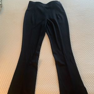 Peach nylon spandex black flare pants. NWOT